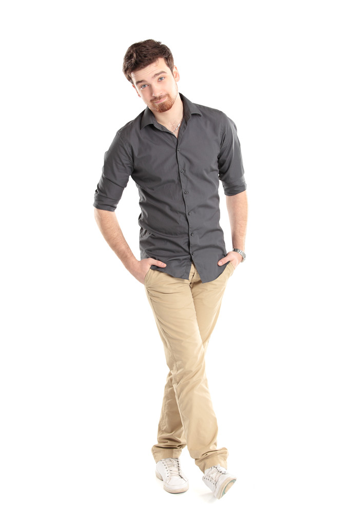 Full length portrait of a stylish young man standing with hands in pockets - Photo, Image