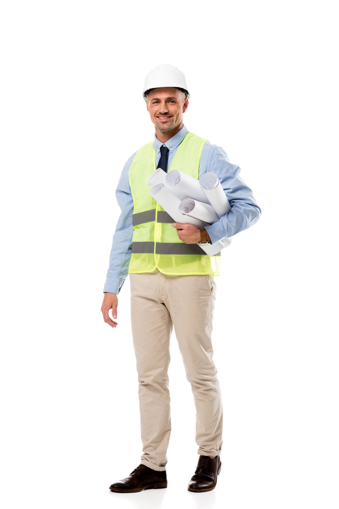 handsome engineer looking at camera and holding blueprints isolated on white - Photo, Image