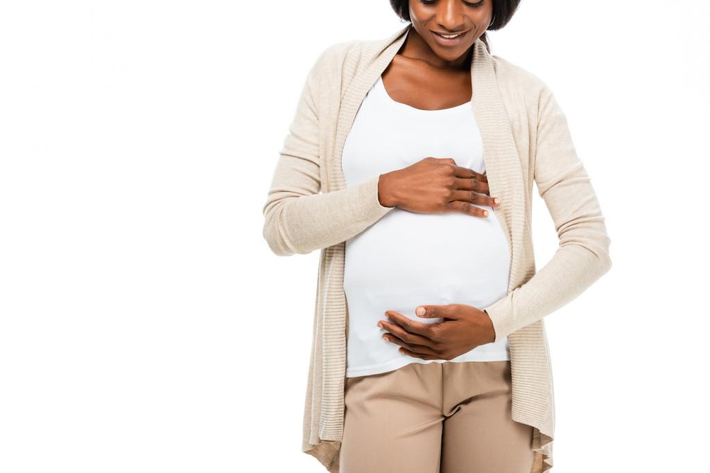 enceinte afro-américaine toucher le ventre isolé sur blanc
 - Photo, image