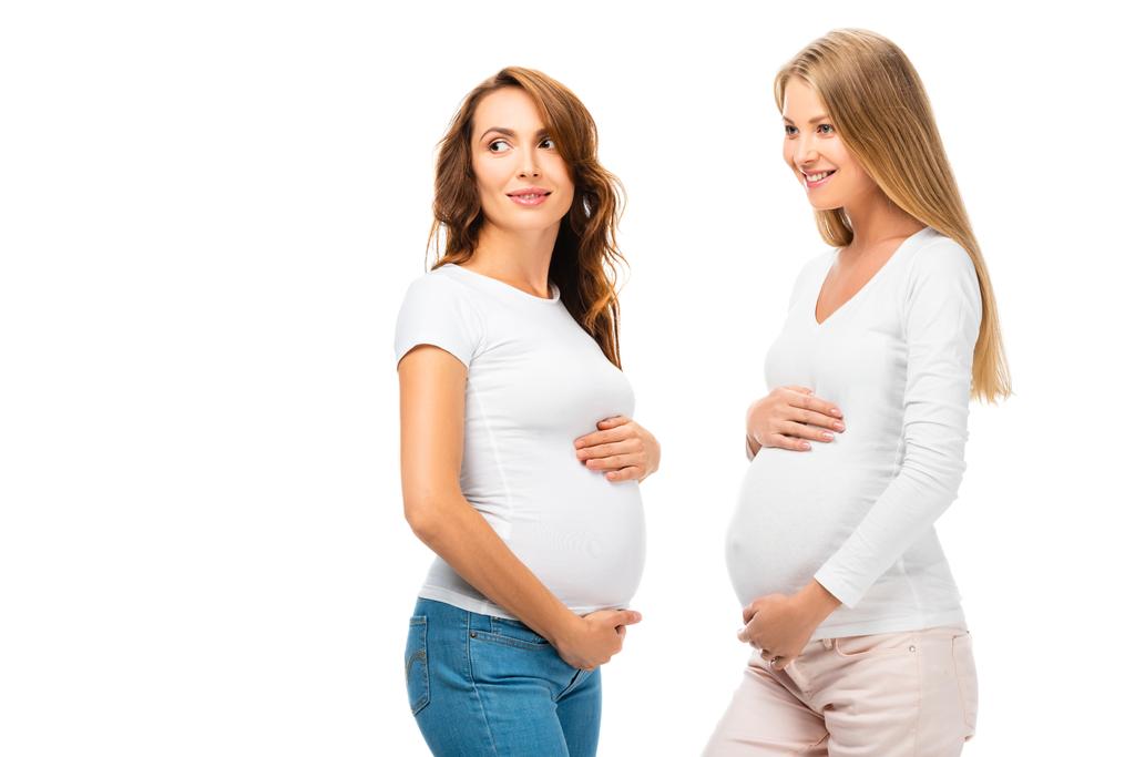 két szép boldog, örömteli terhes nők jelentő elszigetelt fehér - Fotó, kép