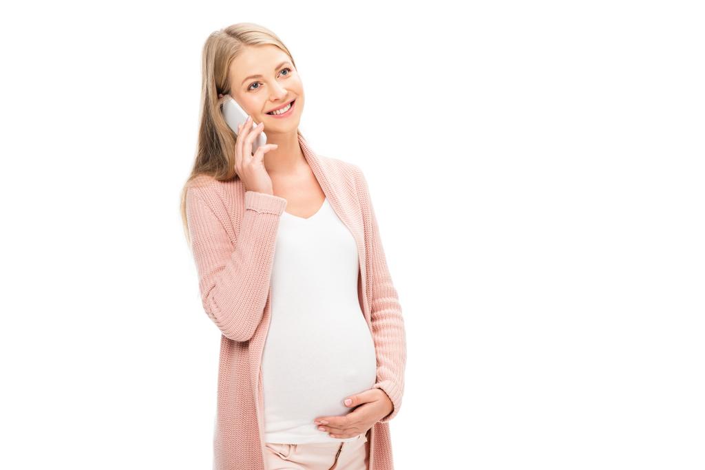 piękna, uśmiechnięta kobieta w ciąży, rozmawiając na smartphone na białym tle - Zdjęcie, obraz