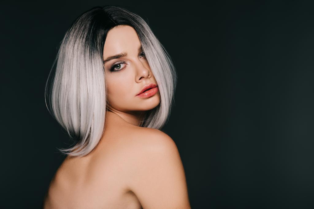 beautiful stylish young woman posing in grey wig, isolated on black - Photo, Image