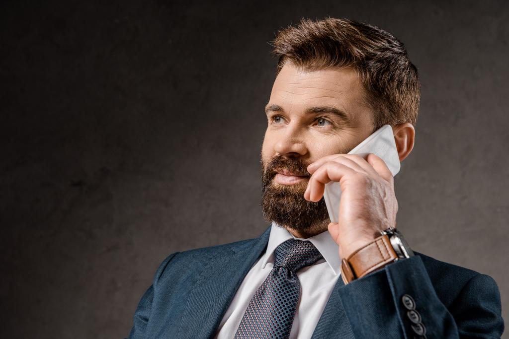 close up of bearded businessman talking on smartphone - Photo, Image