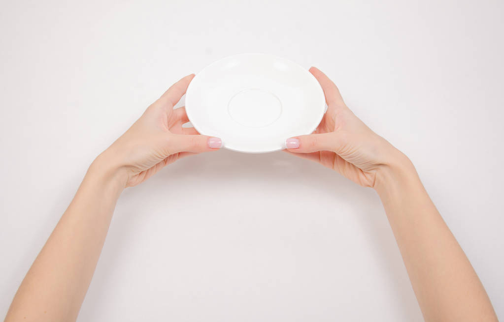 Біла тарілка в руці
 - Фото, зображення