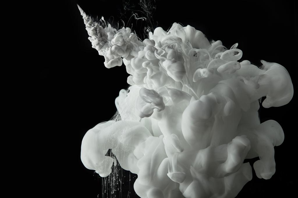white paint splash in water on black texture - Photo, Image