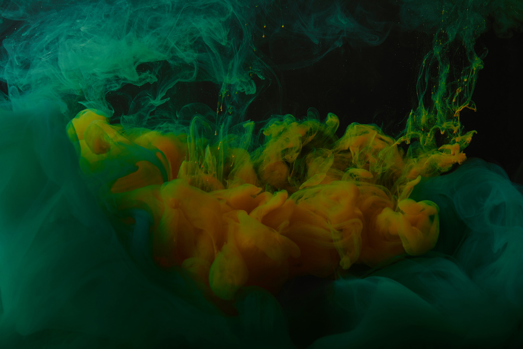 abstract background with green and orange swirls of paint in water - Photo, Image