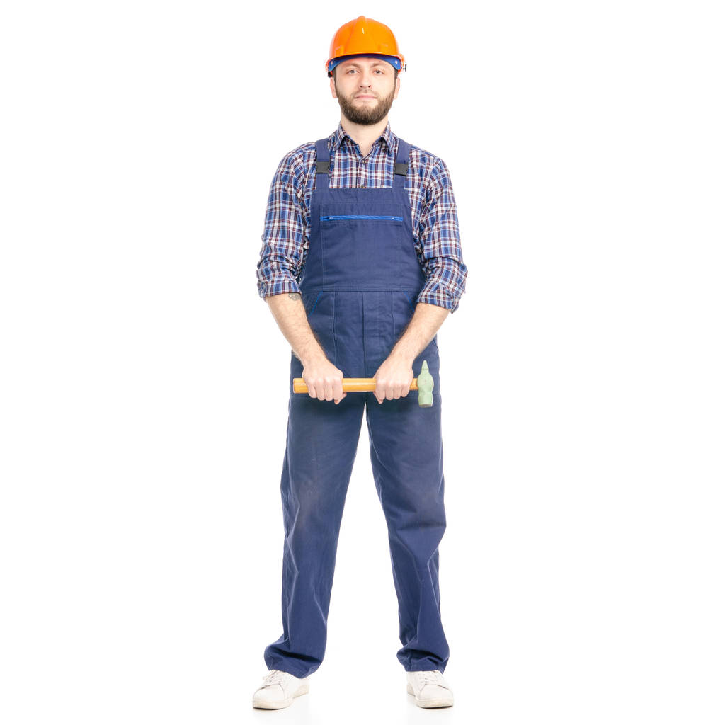 Junger Mann baut Industriearbeiter mit Hammer - Foto, Bild