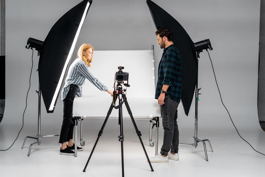 young photographers working with professional equipment in photo studio - Photo, Image