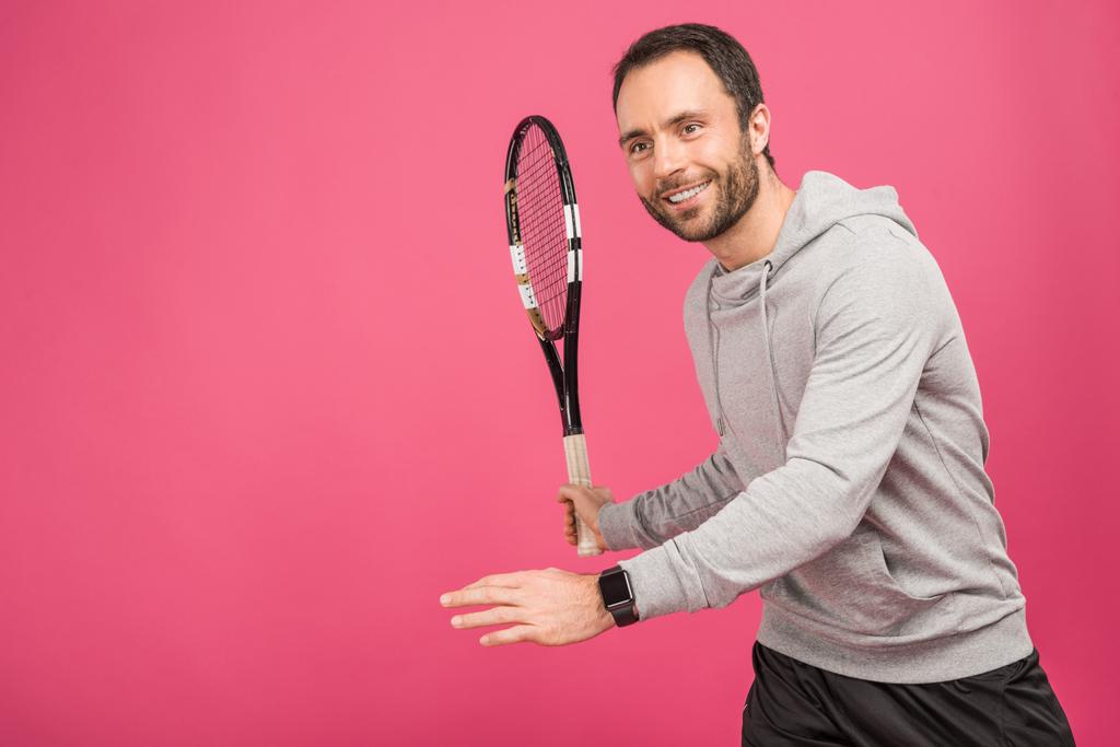 sportive handsome tennis player with racket, isolated on pink - Photo, Image