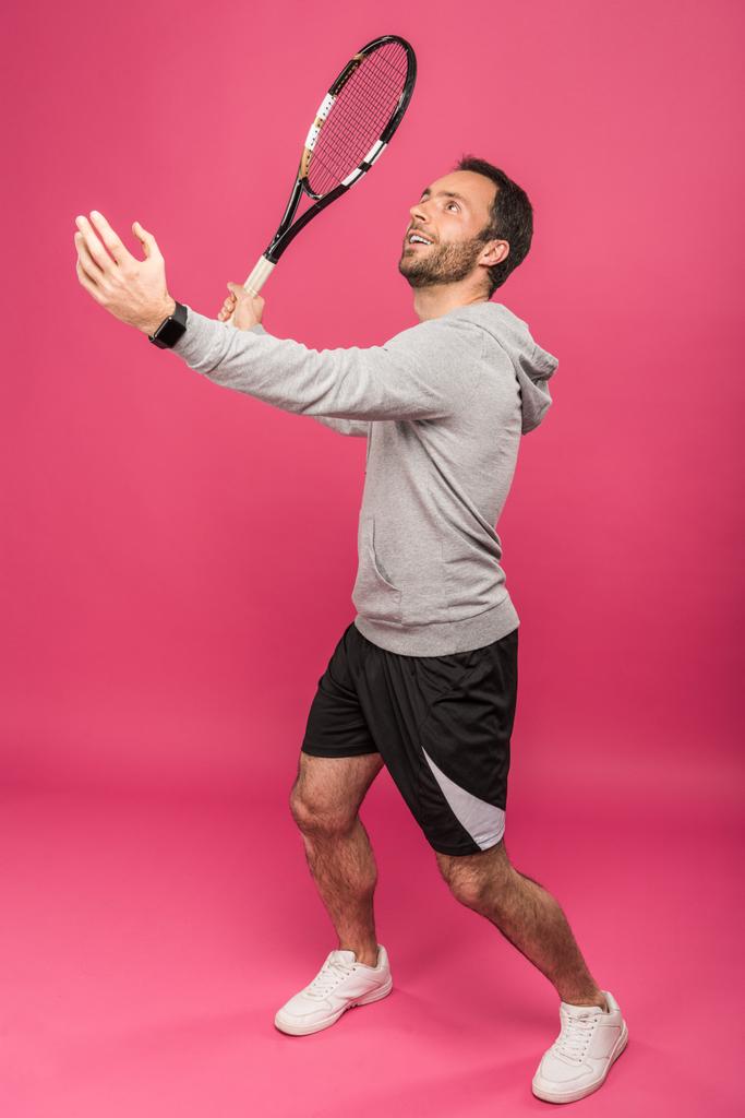 handsome tennis player with racket, isolated on pink - Photo, Image