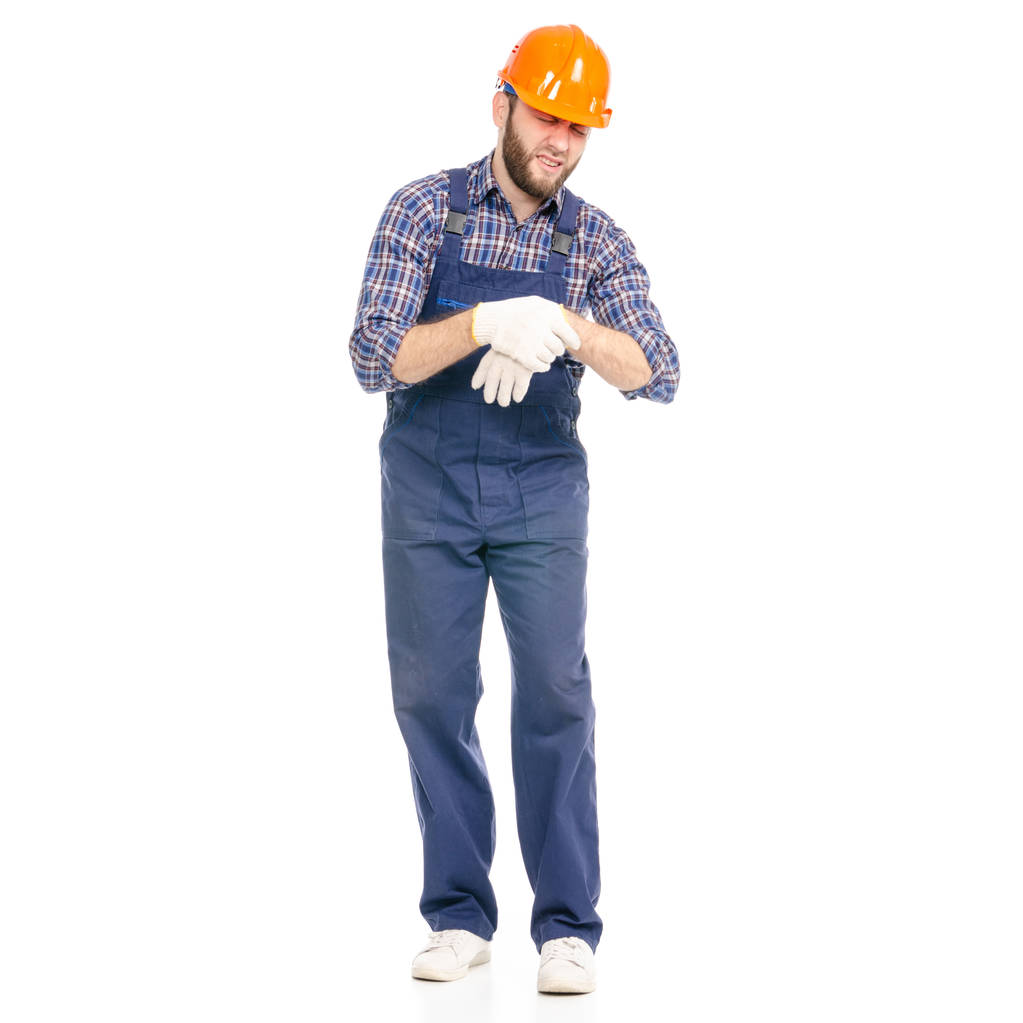 Jonge man bouwer industrie werknemer veiligheidshelm pijn hand - Foto, afbeelding