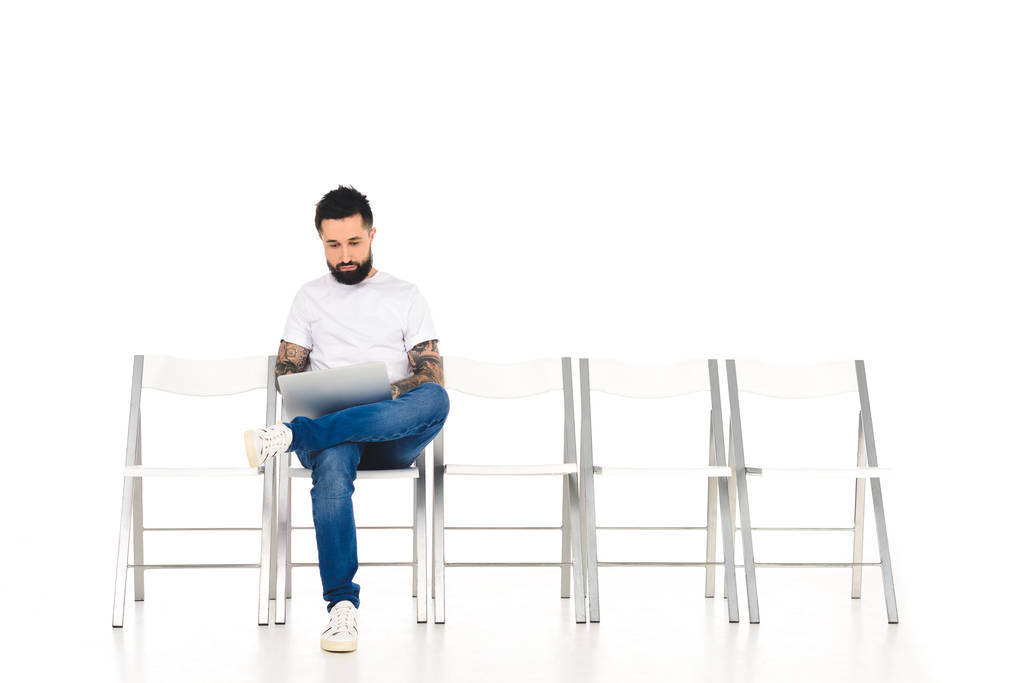 handsome bearded man using laptop isolated on white - Photo, Image