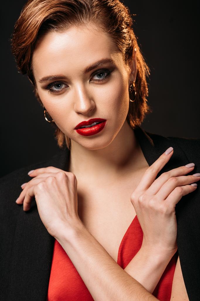 portrait of attractive girl with makeup looking at camera isolated on black - Photo, Image