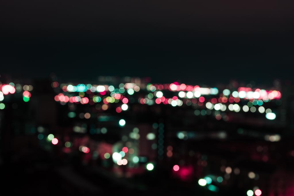 defocused dark background with bright bokeh lights at night  - Photo, Image