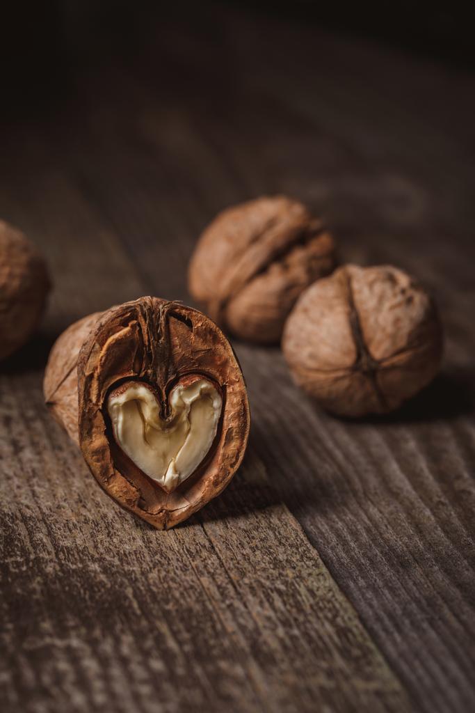 close up view of natural walnuts on wooden tabletop - Photo, Image