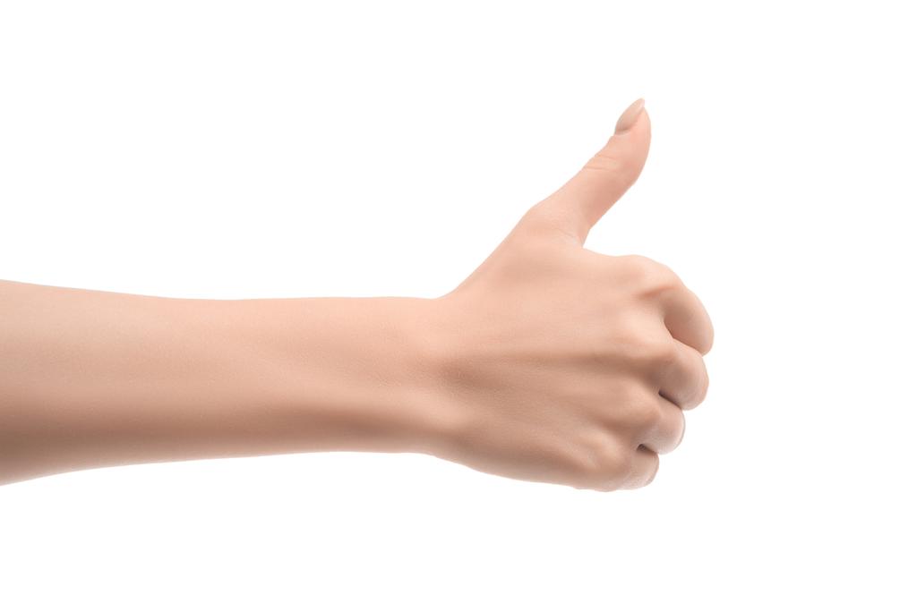částečný pohled žena ukazuje palcem nahoru znamení izolované na bílém - Fotografie, Obrázek