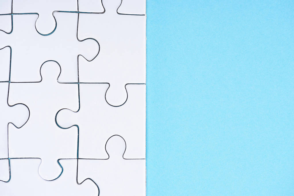 marco completo de disposición de rompecabezas blancos sobre fondo azul
 - Foto, imagen