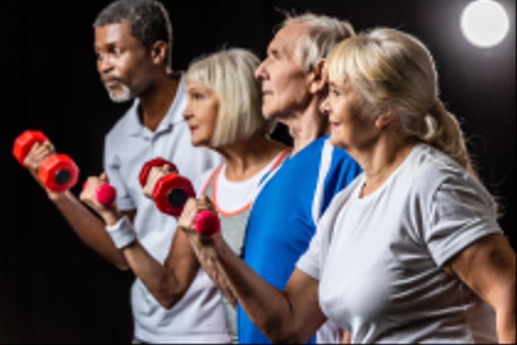 side view of senior mutliethnic sportspeople synchronous exercising with dumbbells on black with spotlight - Photo, Image
