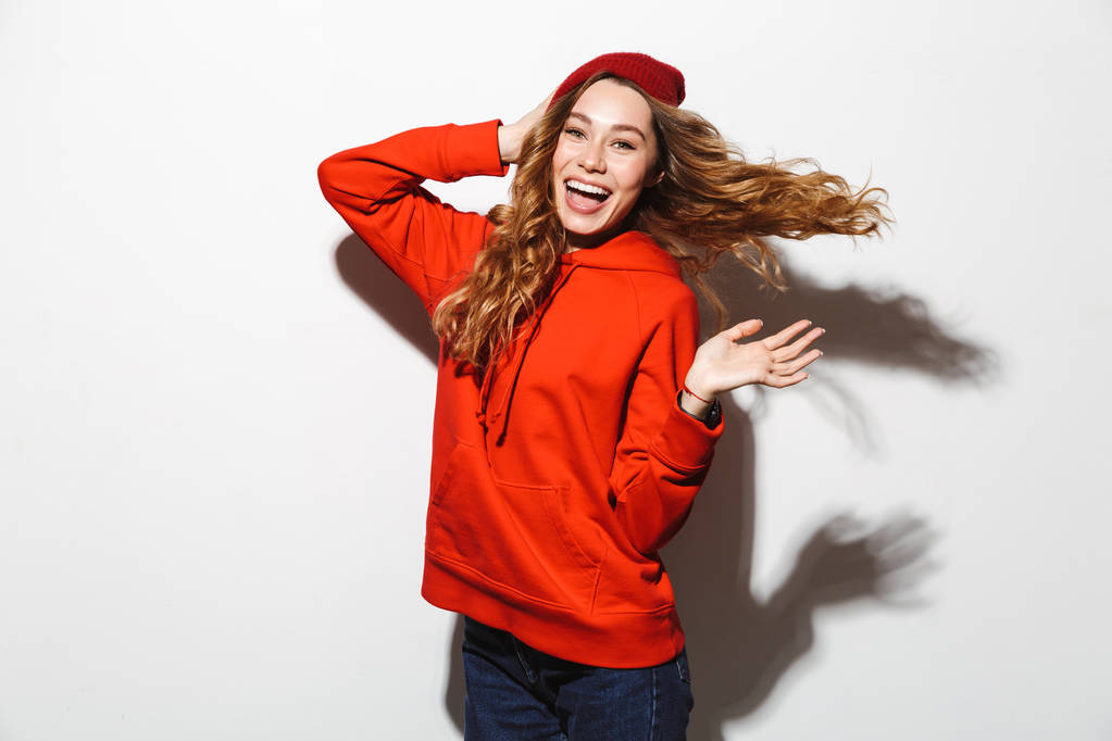 Portrait of cheerful woman 20s wearing casual clothes laughing while standing isolated over white background - Photo, Image