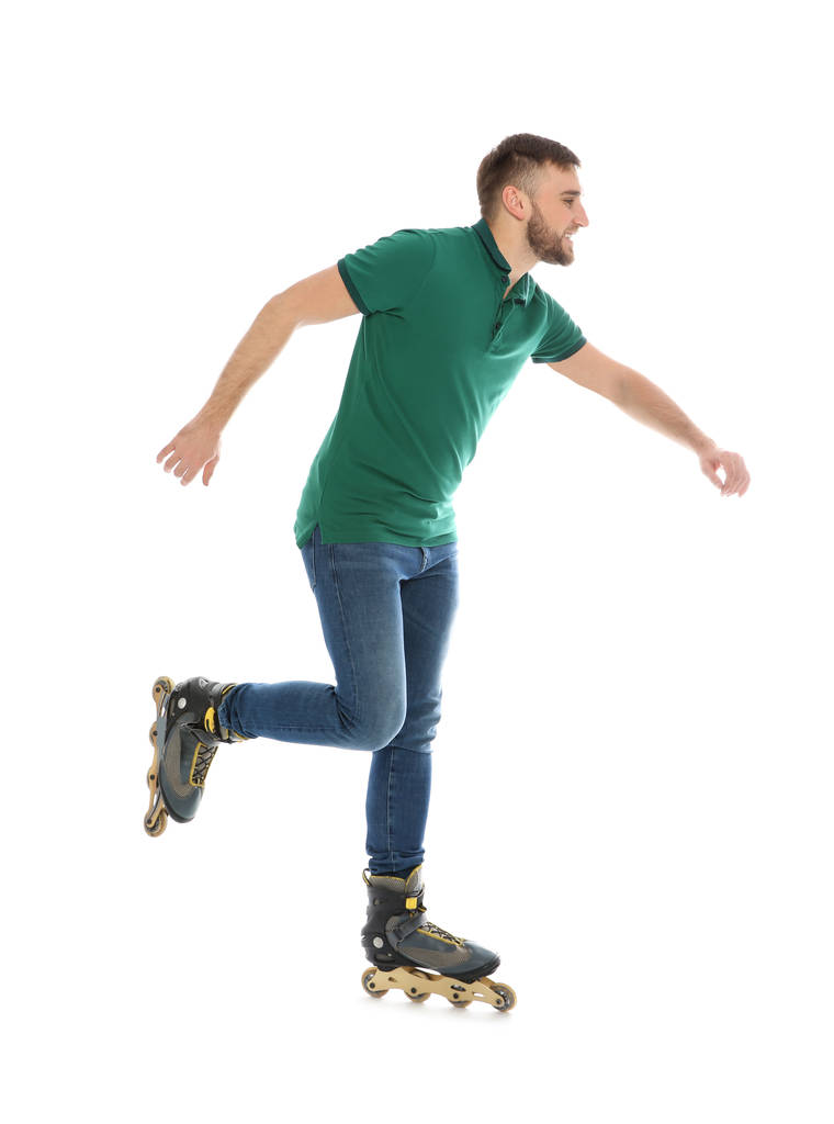 Young man with inline roller skates on white background - Photo, Image