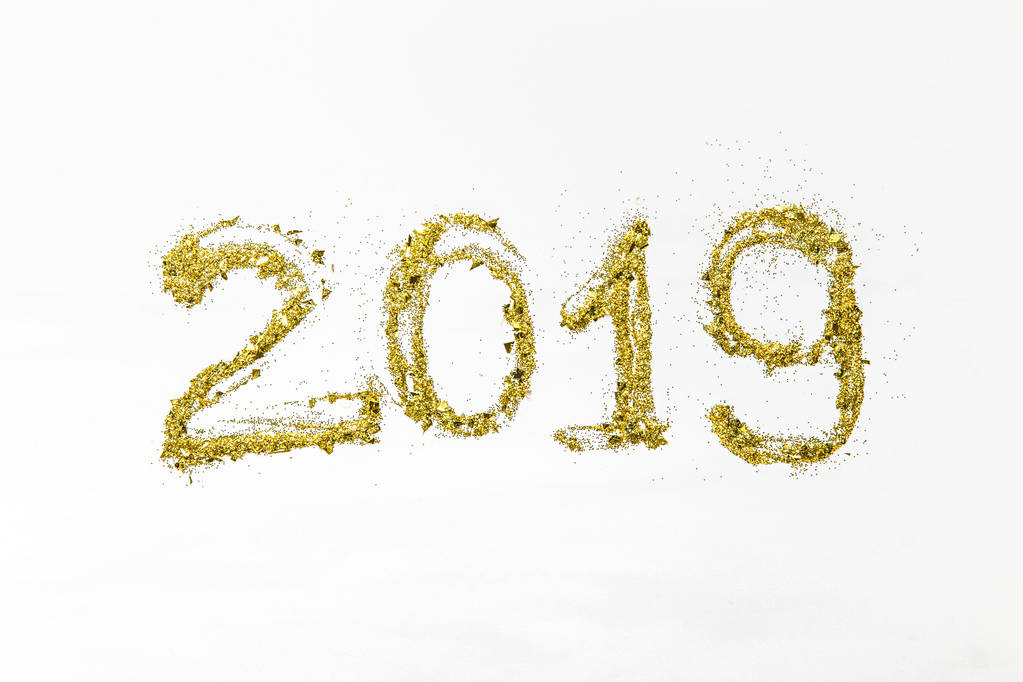 golden glittering 2019 numbers on white background   - Photo, Image