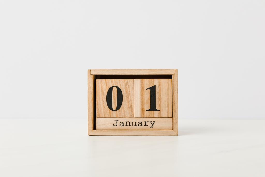 close-up view of wooden calendar with 01 january on white background - Photo, Image