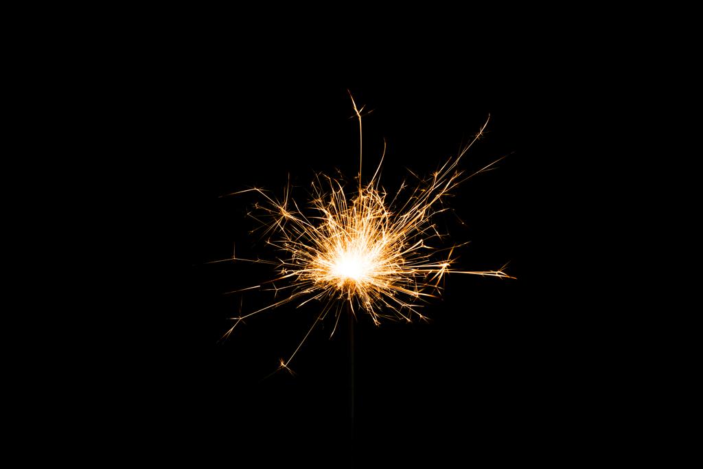 fekete háttér ünnepi újév csillagszóró kiadványról  - Fotó, kép