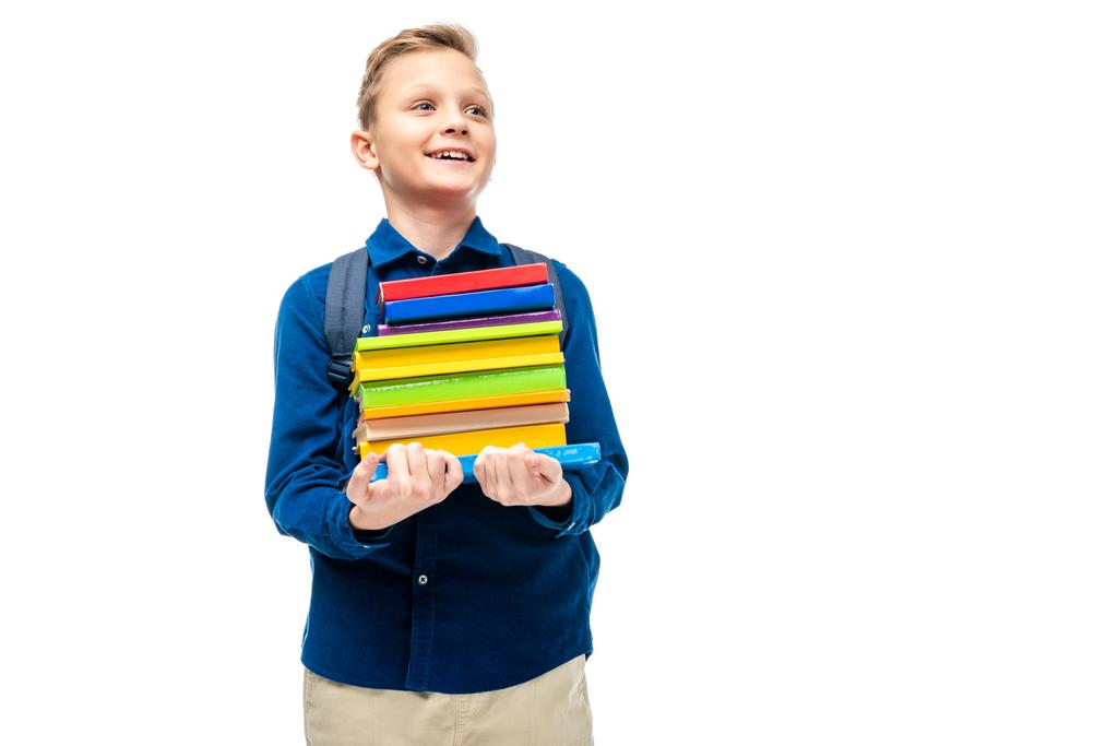 garçon souriant tenant pile de livres isolés sur blanc
 - Photo, image