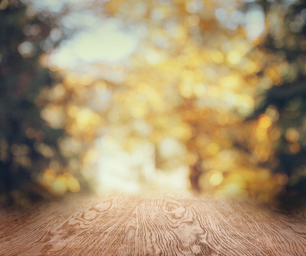 striped wooden background on beautiful blurred autumnal wallpaper - Photo, Image