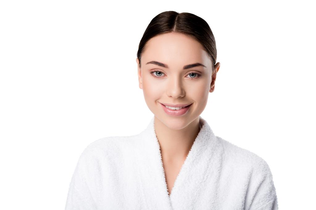 attractive smiling woman in bathrobe looking at camera isolated on white - Photo, Image