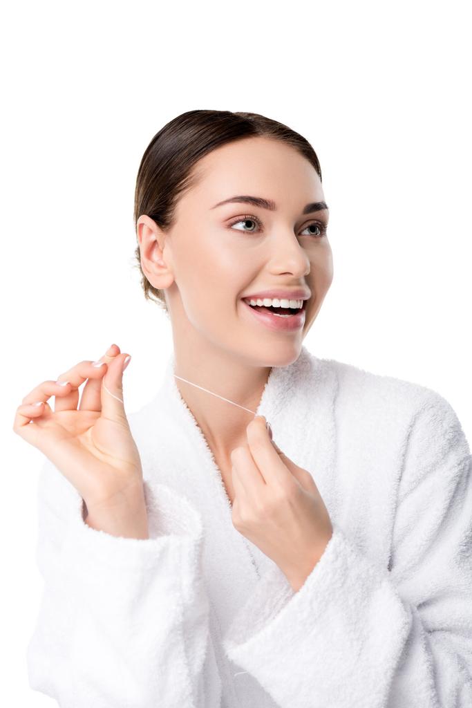 wesoły Kobieta w biały szlafrok z nici dentystycznych na białym tle - Zdjęcie, obraz