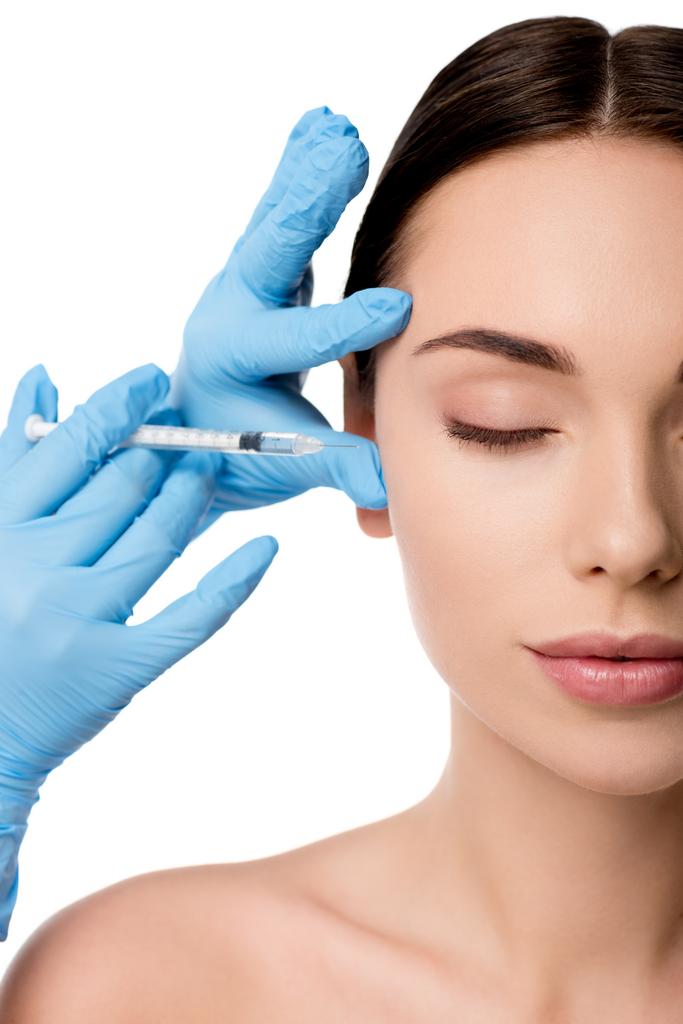 médico em luvas de látex dando injeção de beleza com seringa para mulher nua isolada em branco
 - Foto, Imagem