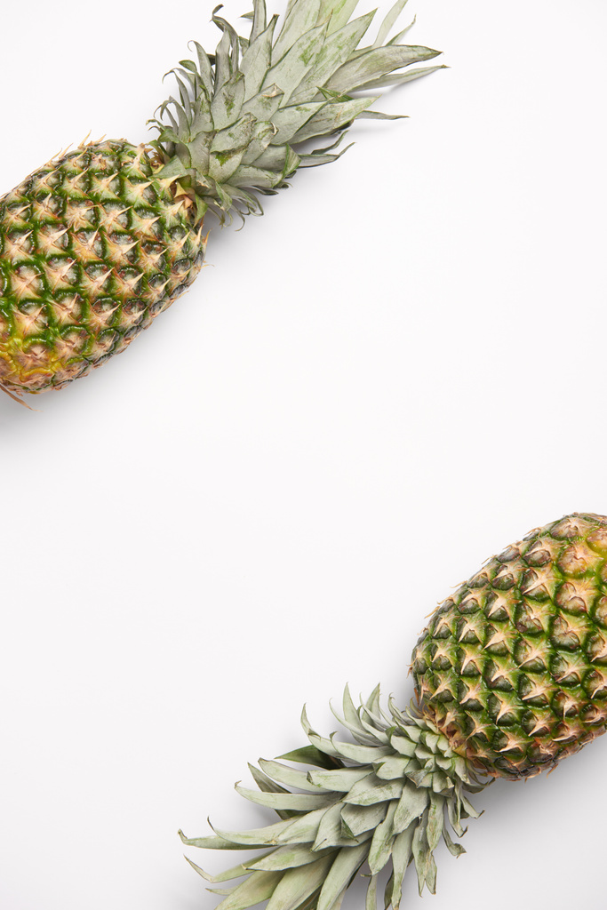 fresh, sweet organic pineapples on white background  - Photo, Image