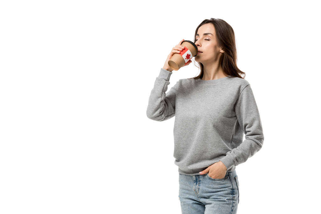 žena pití kávy z poháru s kanadskou vlajku nálepka izolované na bílém - Fotografie, Obrázek