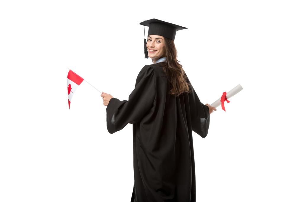 attraente sorridente studentessa in abito accademico con bandiera canadese e diploma isolato su bianco
 - Foto, immagini