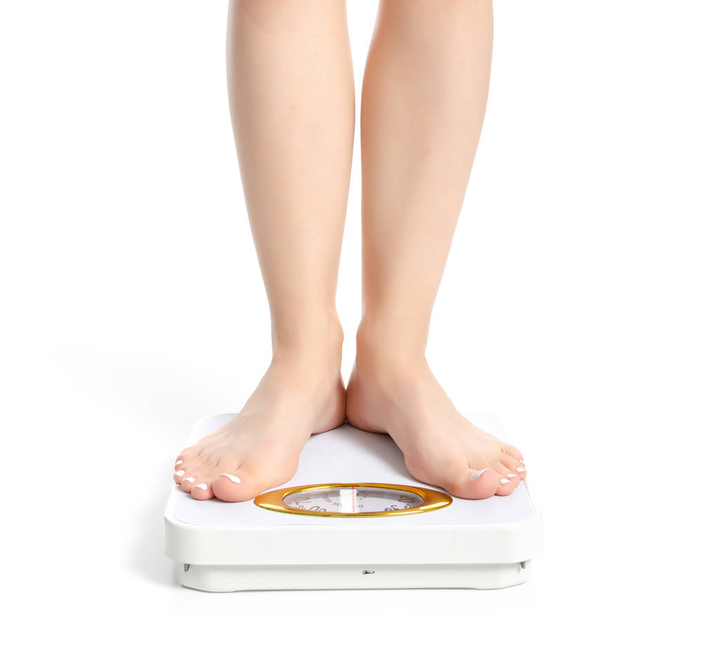 Female feet weighing scale - Photo, Image
