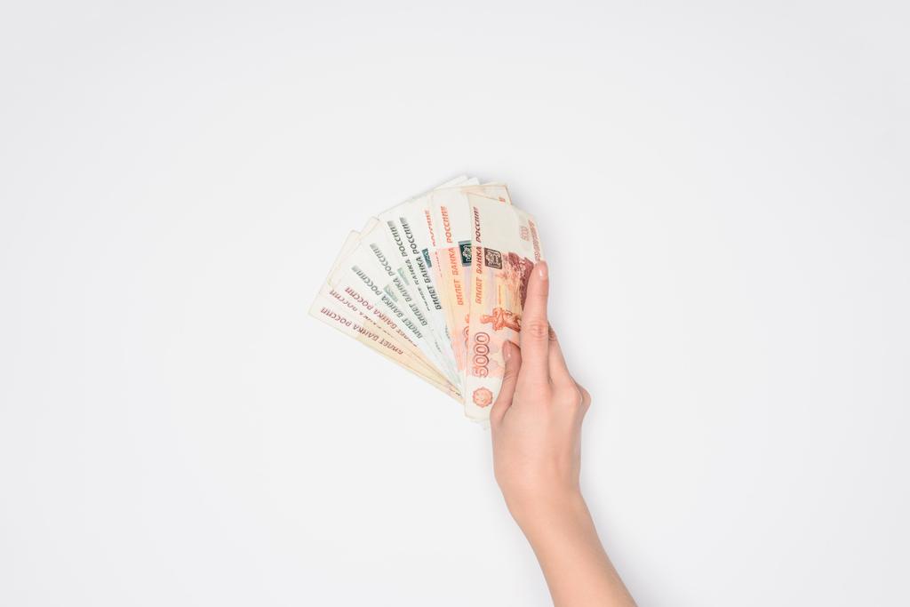vista ritagliata di donna in possesso di rubli russi in mano isolato su grigio
 - Foto, immagini