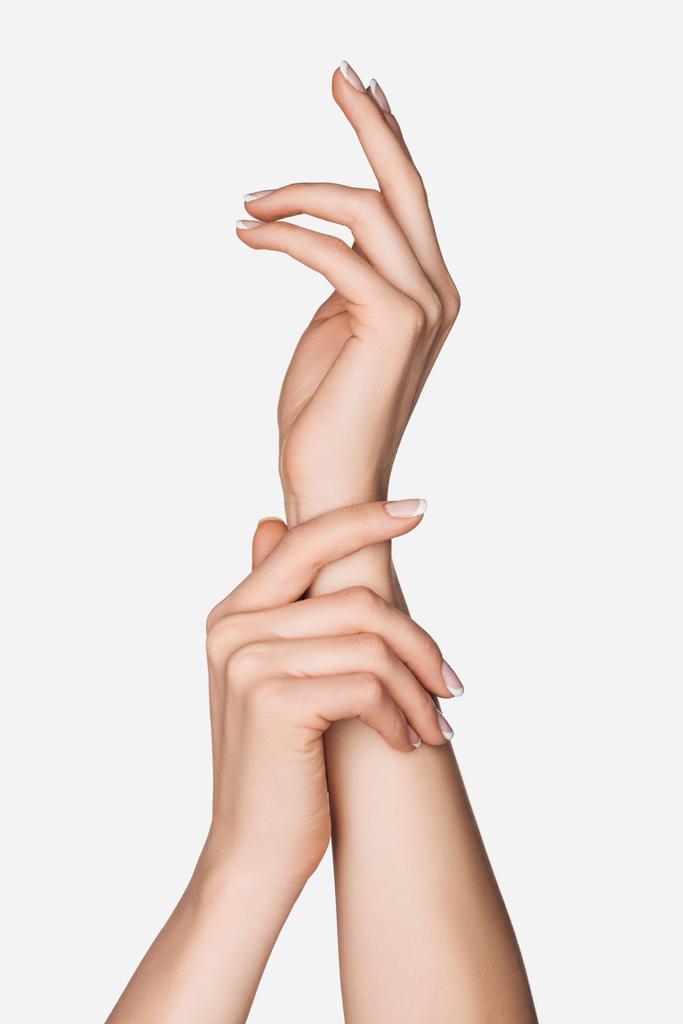 обрезанный вид женских рук, изолированных на белом - Фото, изображение