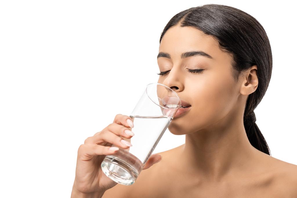 attractive young african american woman with closed eyes drinking water from glass isolated on white - Photo, Image