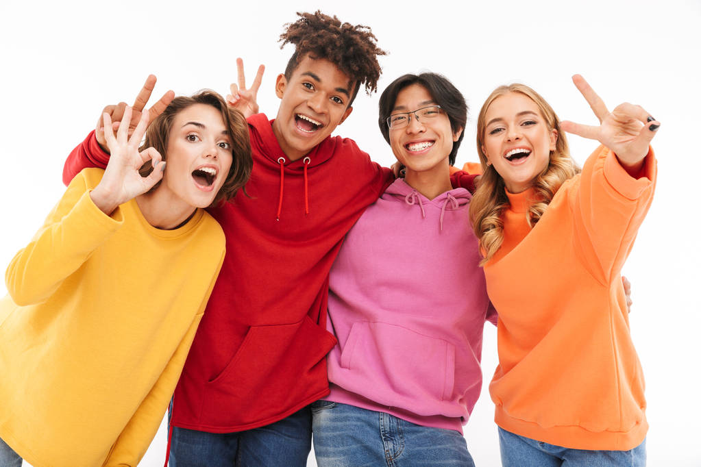 Group of cheerful teenagers isolated over white background - Photo, Image