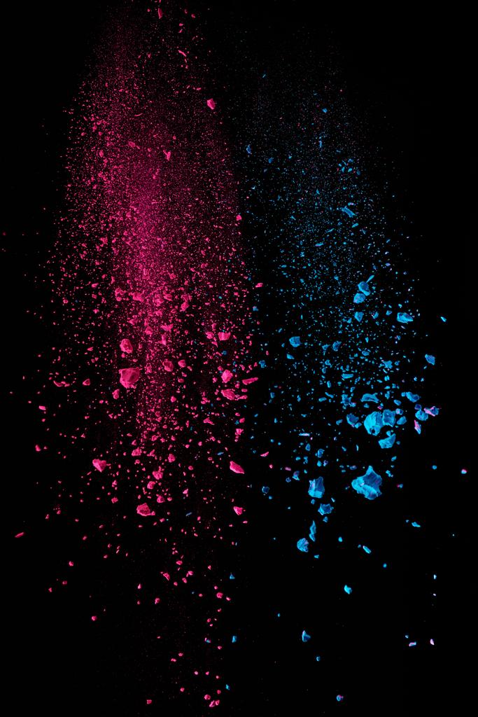  pink and blue holi powder in air on black background - Photo, Image