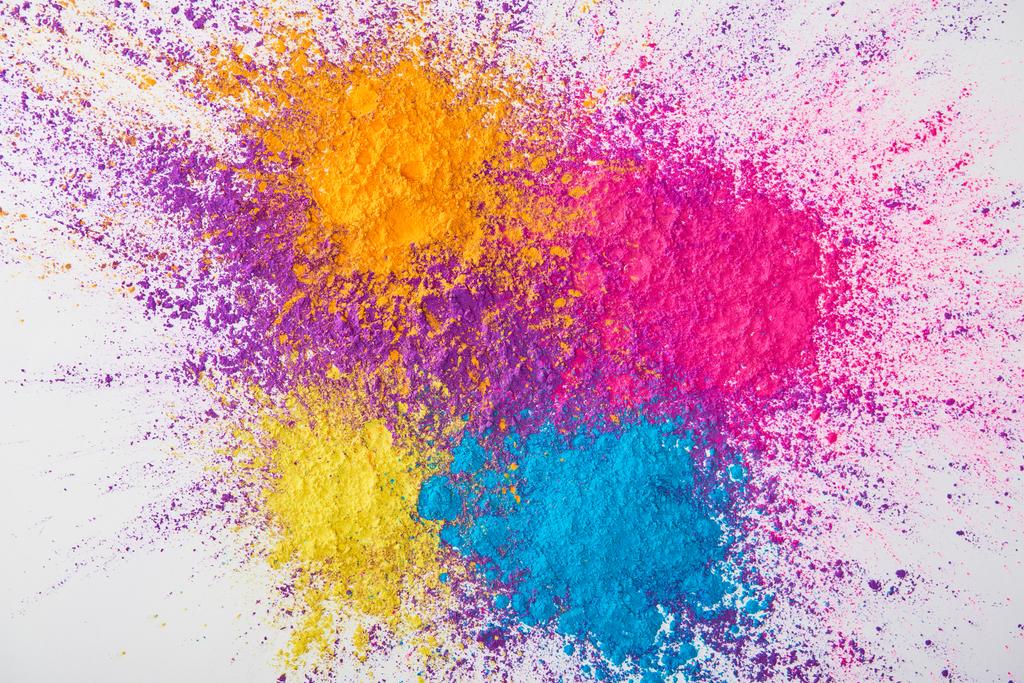 top view of explosion of multicolored holi powder on white background - Photo, Image