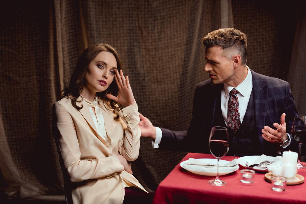 couple quarreling while having romantic date in restaurant - Photo, Image