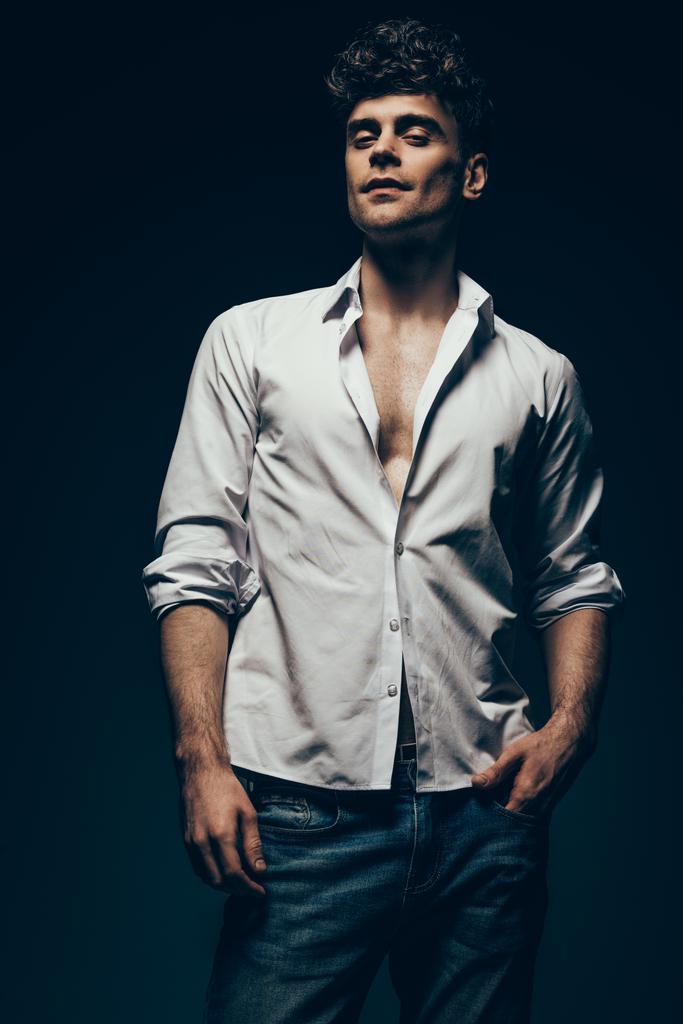 fashionable sexy man posing in white shirt isolated on dark grey - Fotoğraf, Görsel