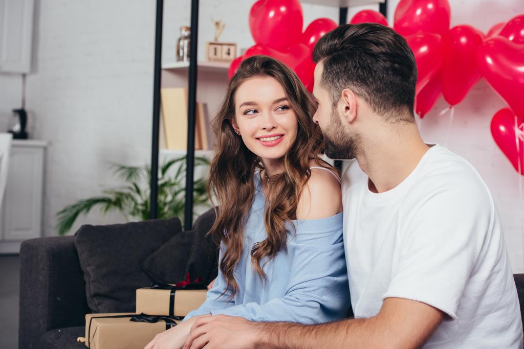 loving young couple celebrating valentines day at home - Photo, Image