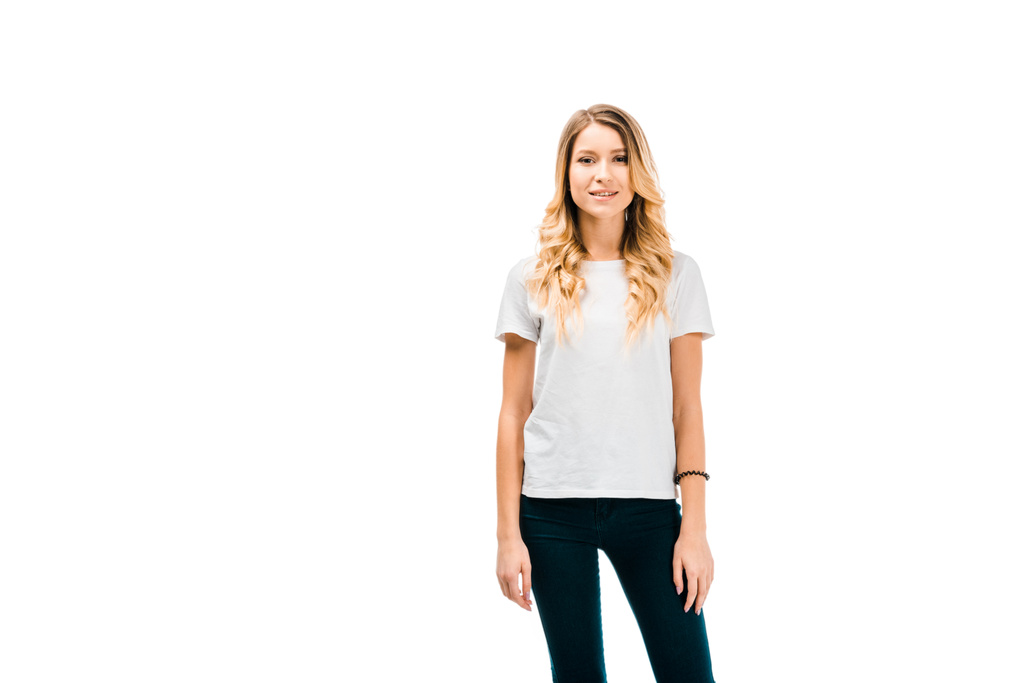 beautiful blonde girl in white t-shirt standing and looking at camera isolated on white - Photo, Image