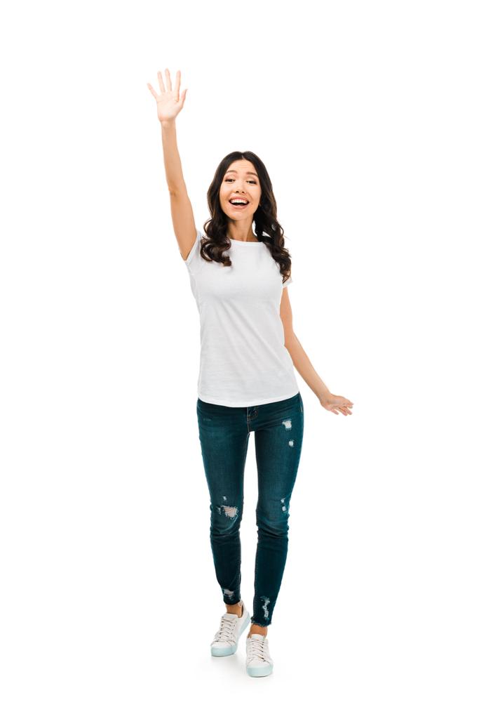 full length view of happy brunette girl waving hand isolated on white - Photo, Image