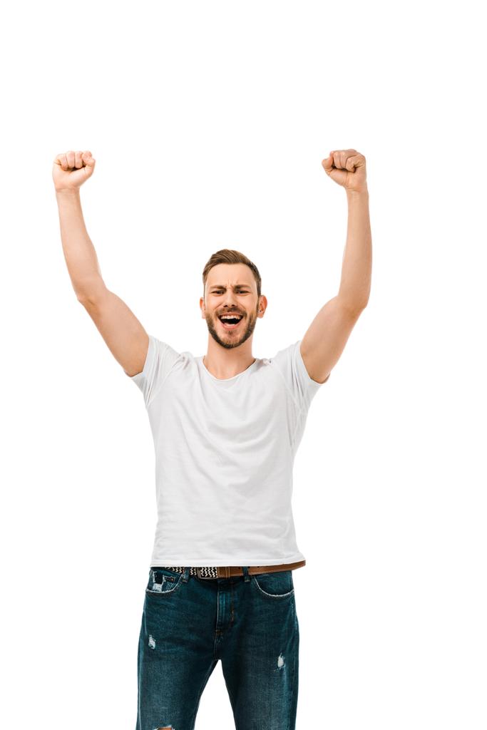 handsome happy man raising hands and shaking fists isolated on white - Photo, Image