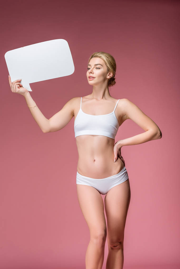 beautiful girl in white underwear posing with speech bubble, isolated on pink - Photo, Image