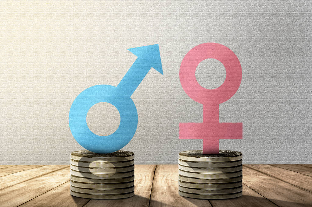 männliche und weibliche Geschlechtssymbole auf einem Stapel von Münzen gleicher Höhe. Gleichberechtigungskonzept - Foto, Bild
